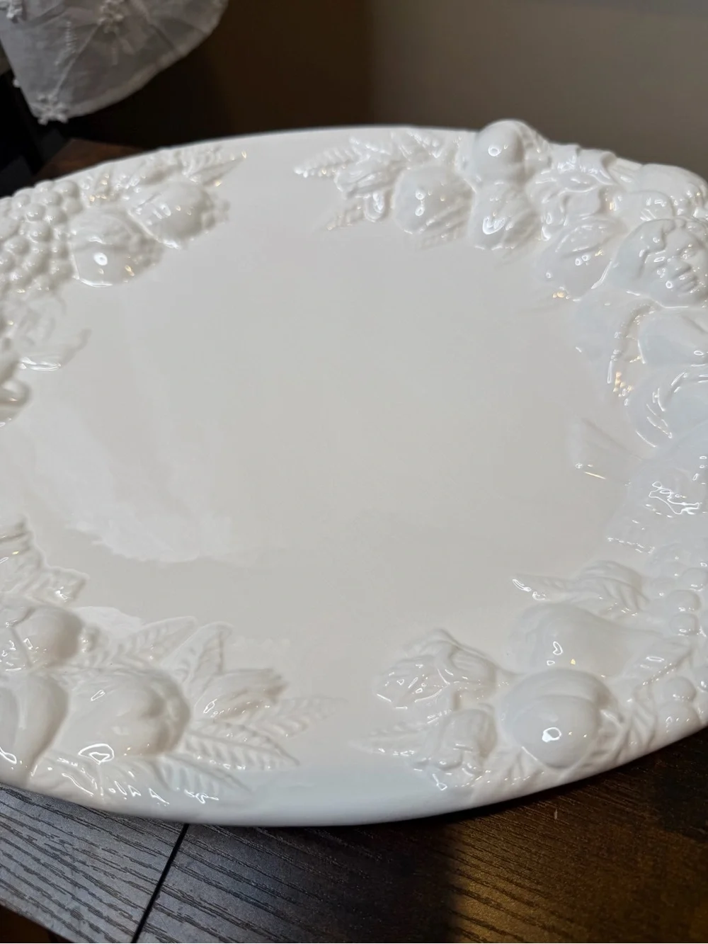 White glazed ceramic oval serving platter classical bacchanalian cherub embossed